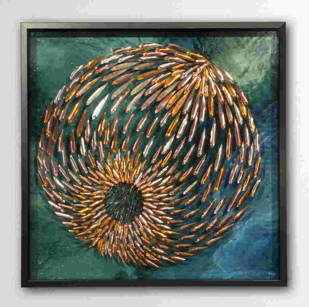 Three-dimensional wall sculpture, school of fish theme, with layers of plexiglass, aluminum frame and spherical aluminum fish.