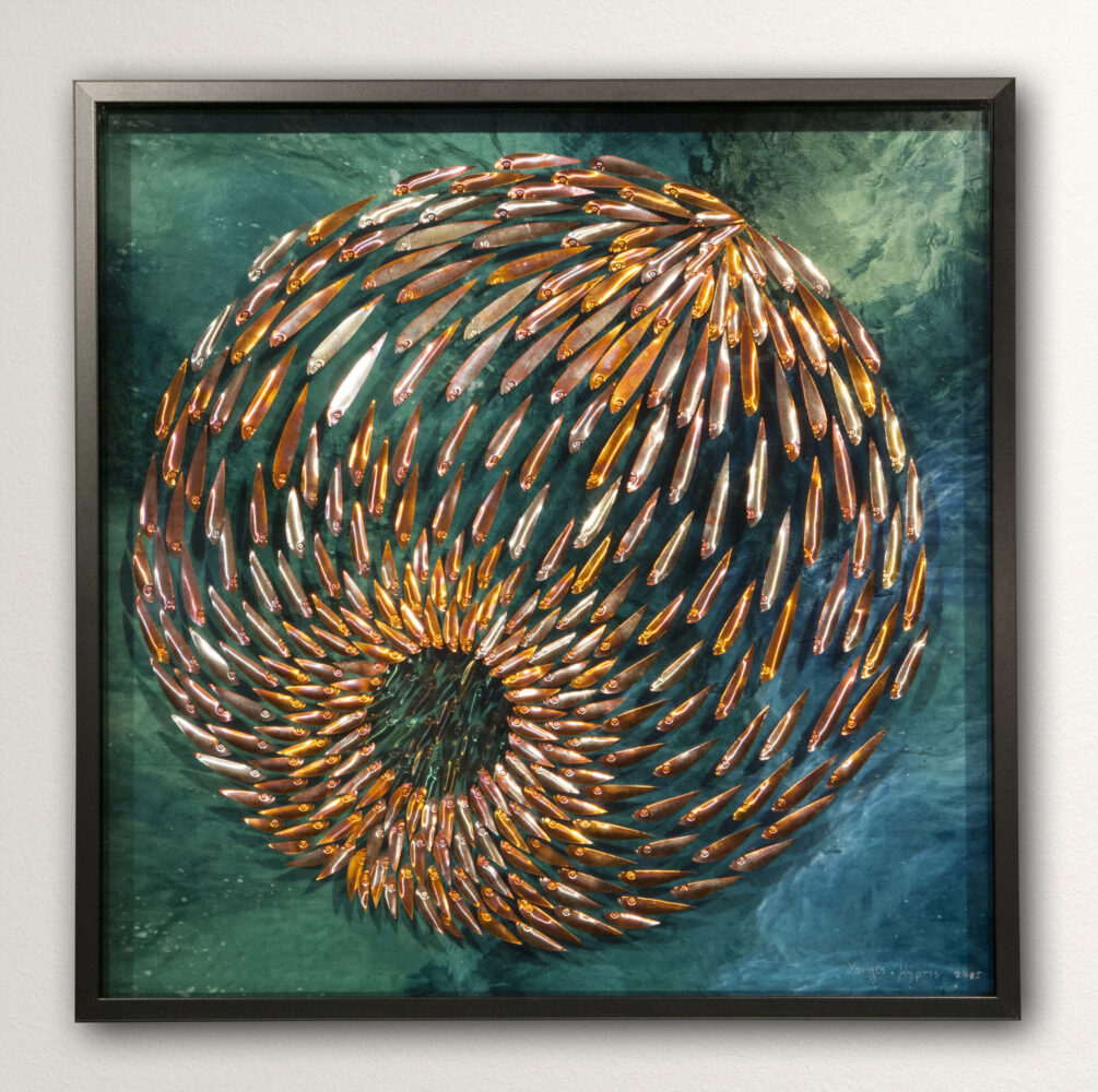 Three-dimensional wall sculpture, school of fish theme, with layers of plexiglass, aluminum frame and spherical aluminum fish.
