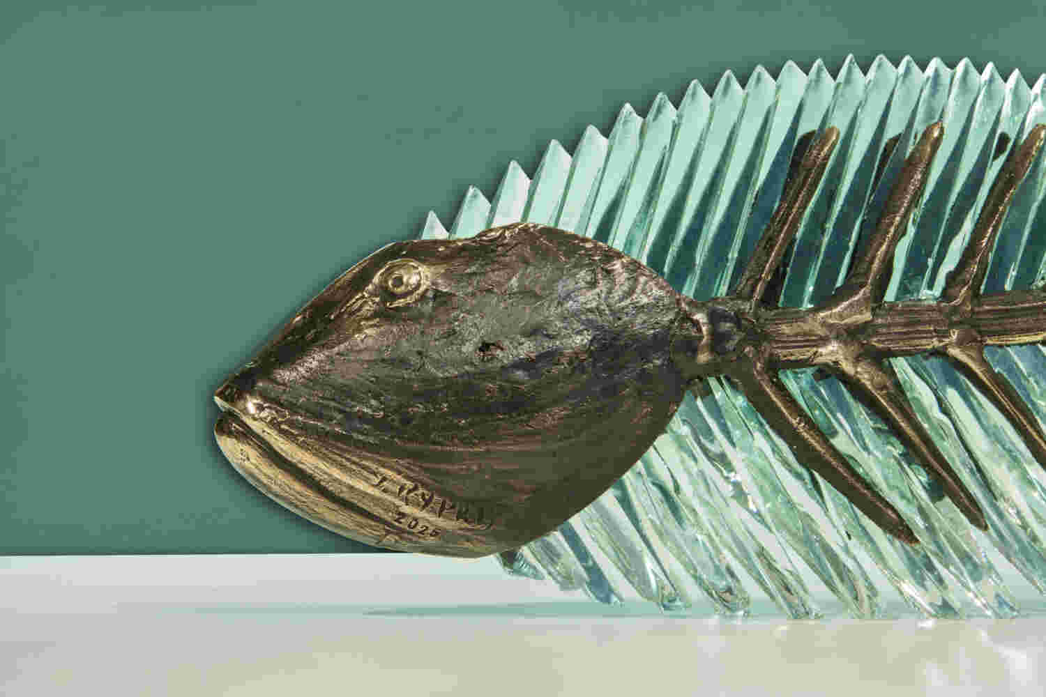 Cast bronze & glass sculpture of a fish. “Frozen Fish”.