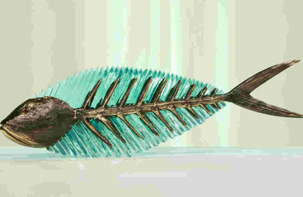 Cast bronze & glass sculpture of a fish. “Frozen Fish”.