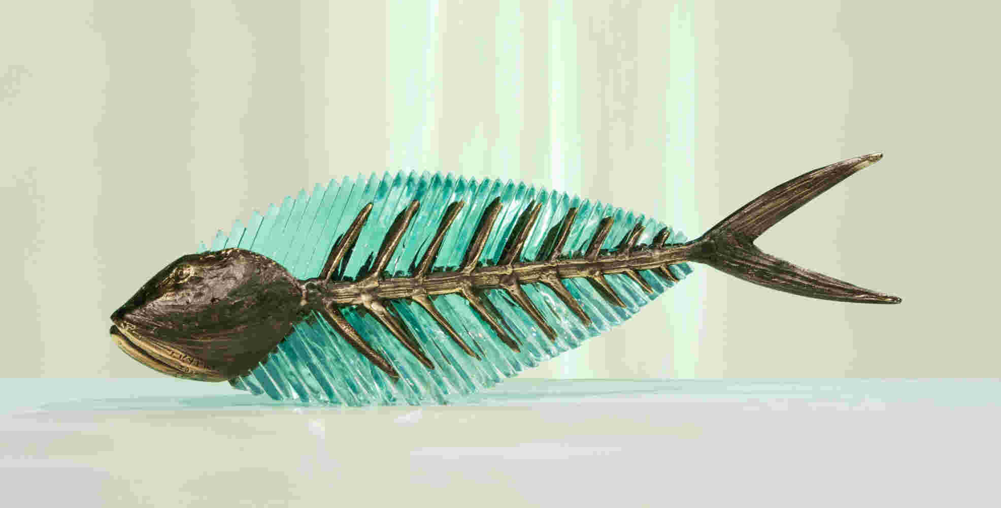 Cast bronze & glass sculpture of a fish. “Frozen Fish”.