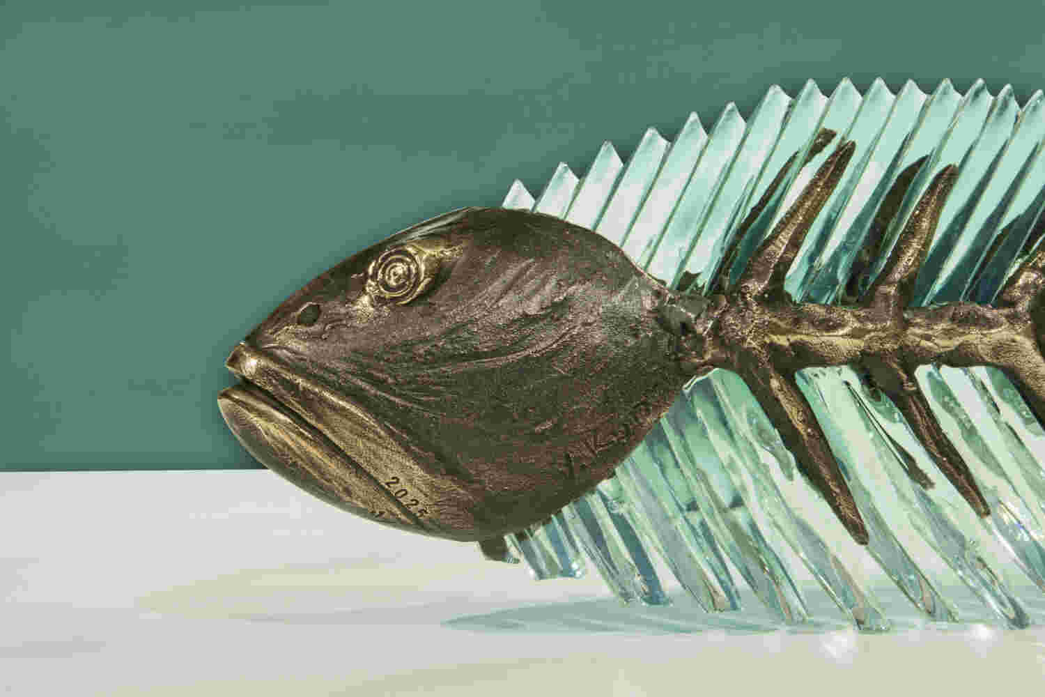 Cast bronze & glass sculpture of a fish. “Frozen Fish”.
