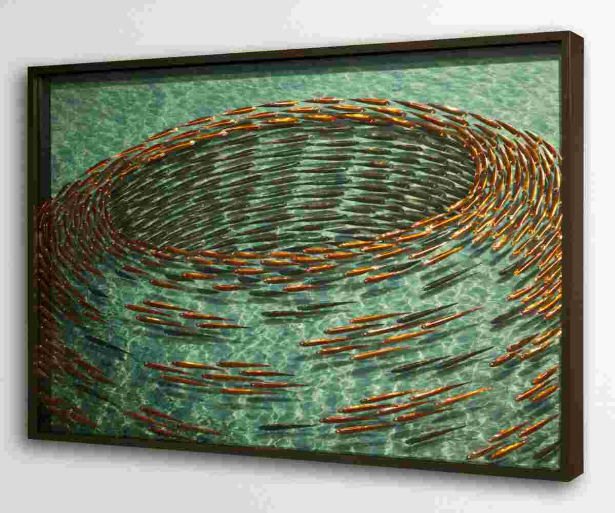 Three-dimensional wall sculpture, school of fish theme, with layers of plexiglass, aluminum frame and swirling aluminum and copper fish.