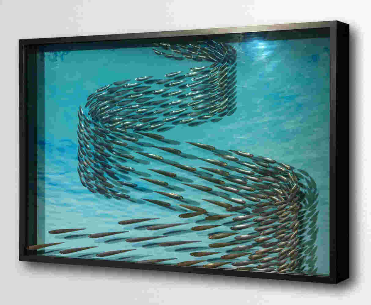 Three-dimensional wall sculpture, school of fish theme, with layers of plexiglass, aluminum frame and swirling copper fish.