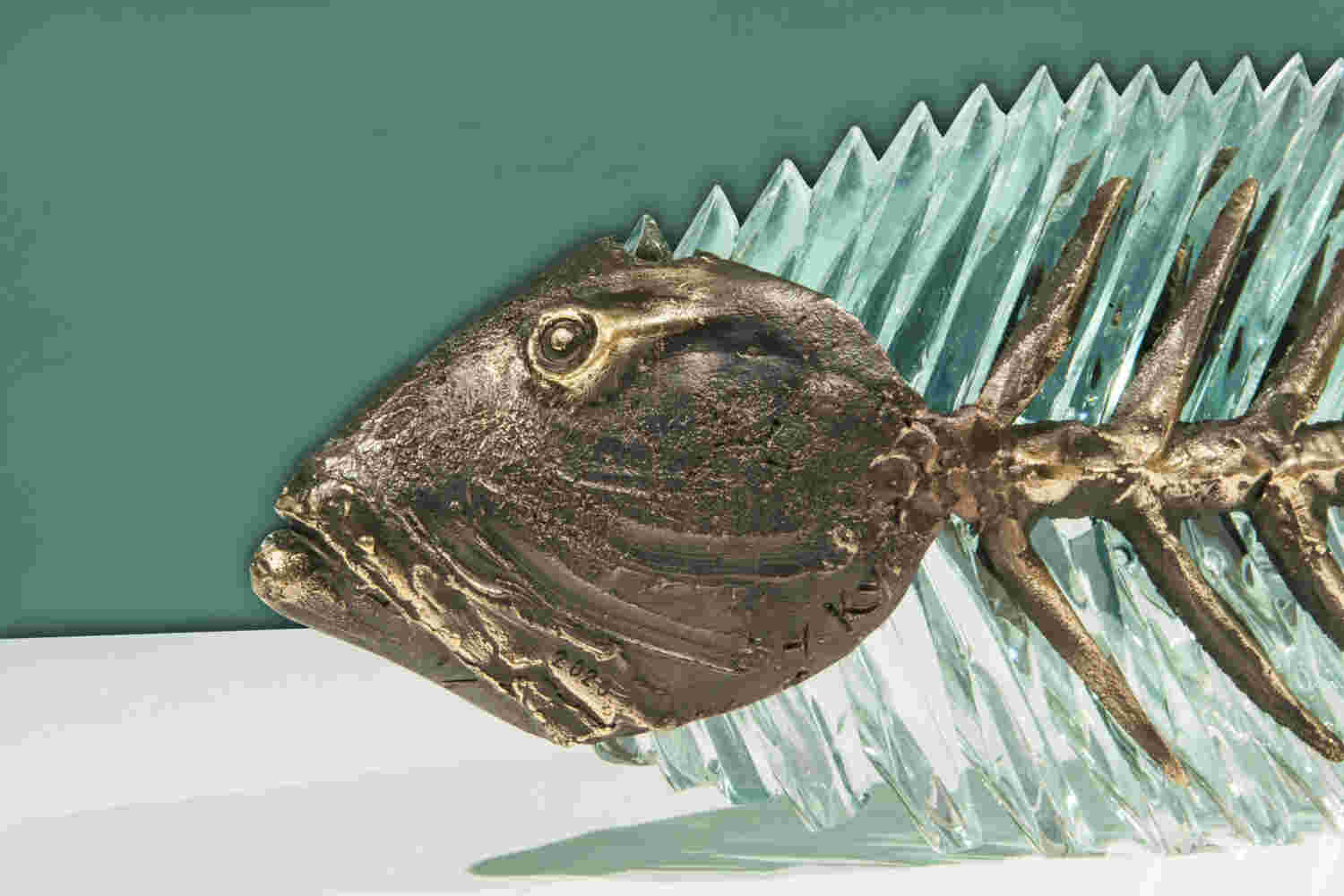 Cast bronze & glass sculpture of a fish. “Frozen Fish”.
